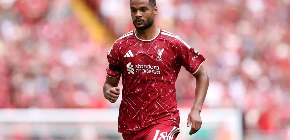 Player wearing Liverpool kit during match at stadium