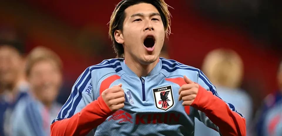 Player celebrating during pre-match warm-up for Japan