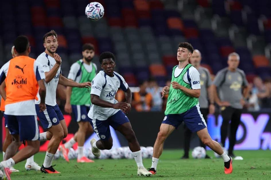 Players training and practicing passes on the field