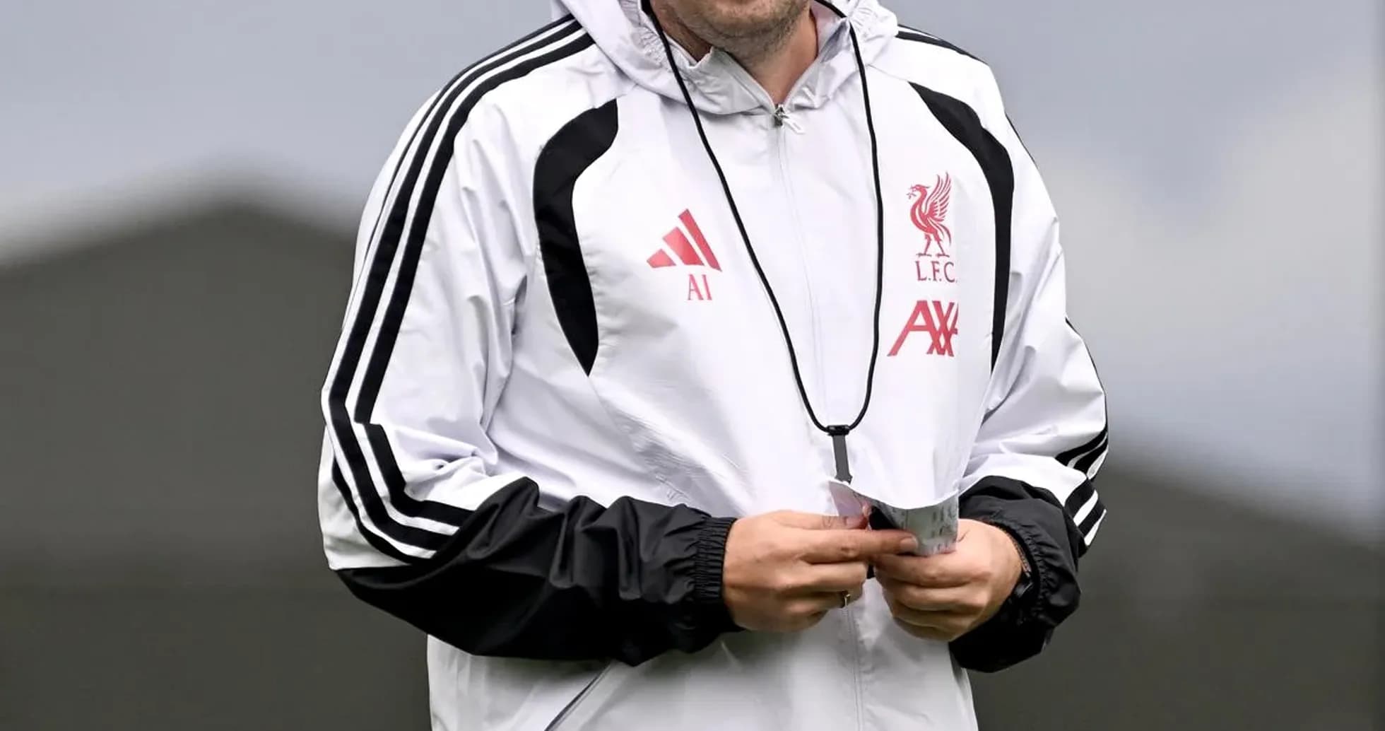 Assistant coach walking during Liverpool training session