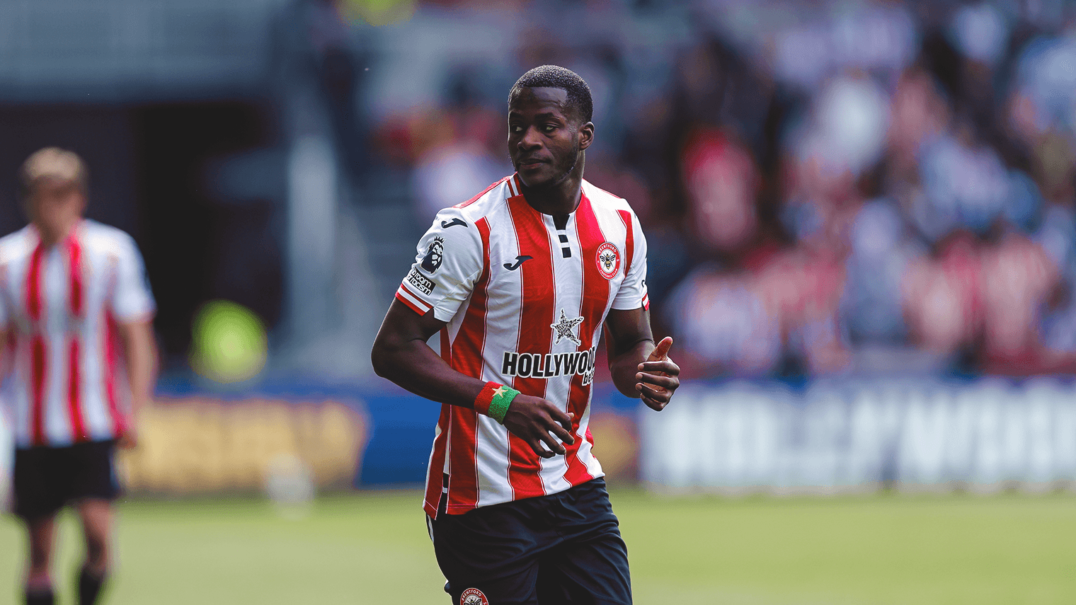 Player in Brentford kit during Premier League match