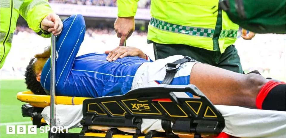 Player being carried on stretcher by medical staff
