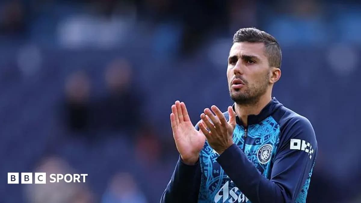 Player applauding fans during warm-up on pitch Player applauding fans during warm-up on pitch
