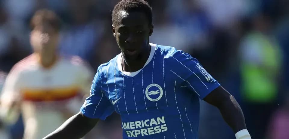 Player in blue kit running with the ball