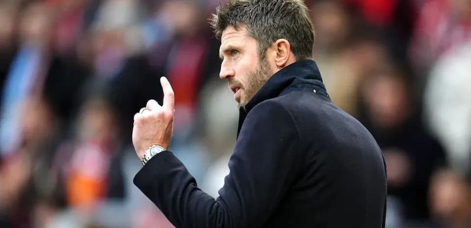 Coach gesturing during a match from the sidelines