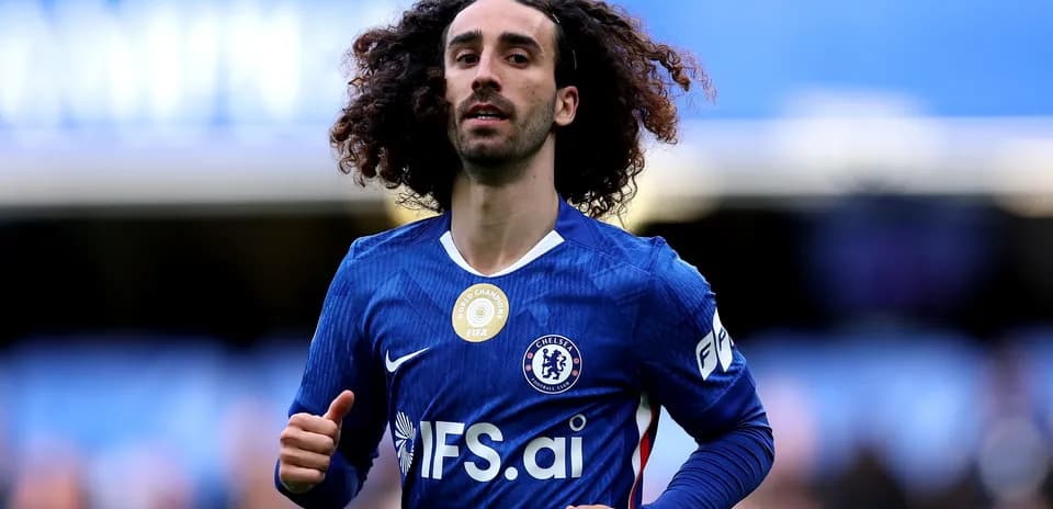 Player running on the pitch wearing Chelsea jersey