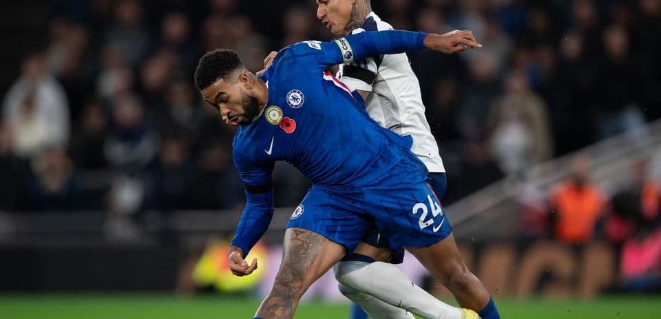 Chelsea player challenged by Tottenham opponent