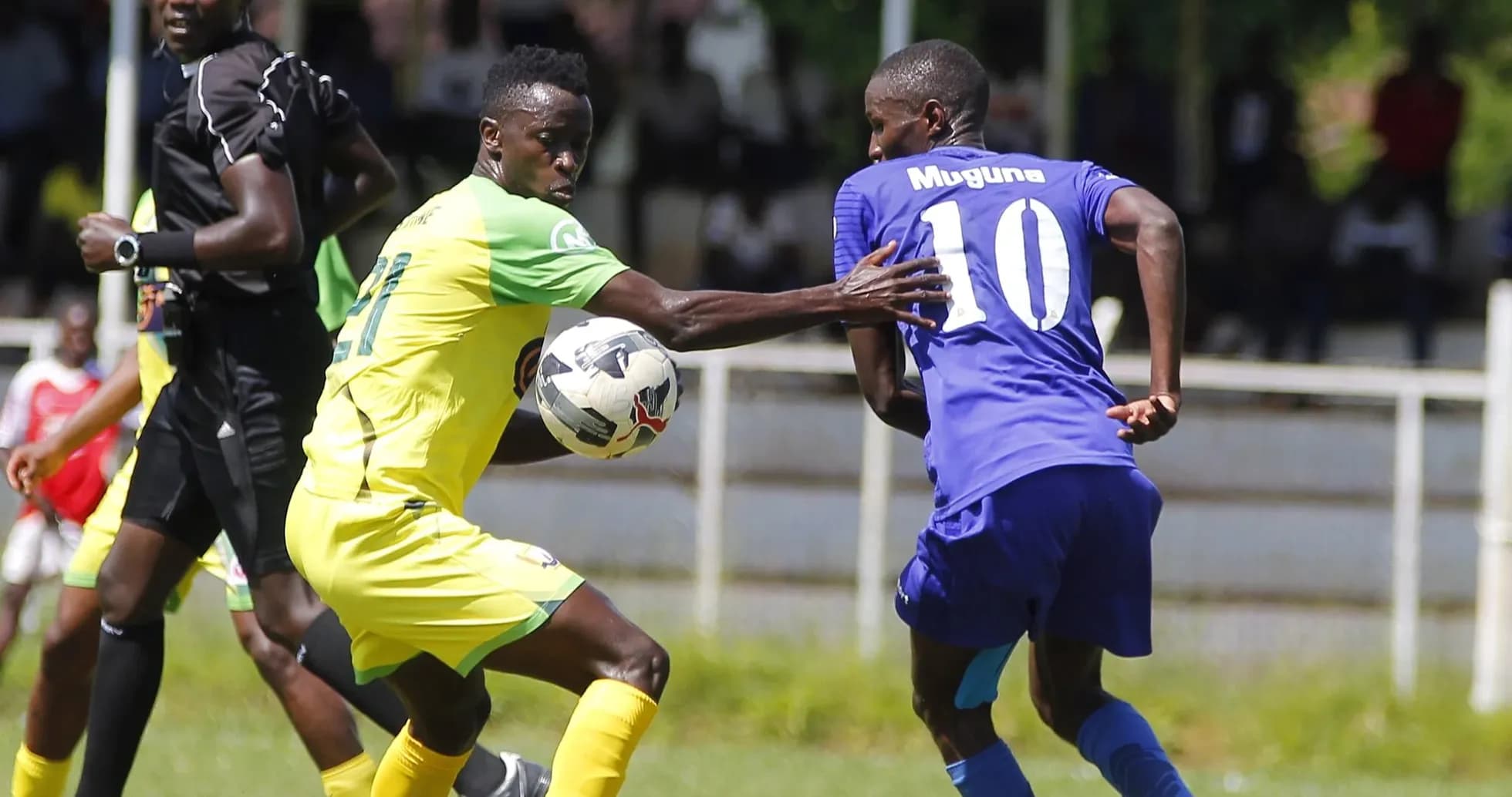 Players contesting for the ball during match