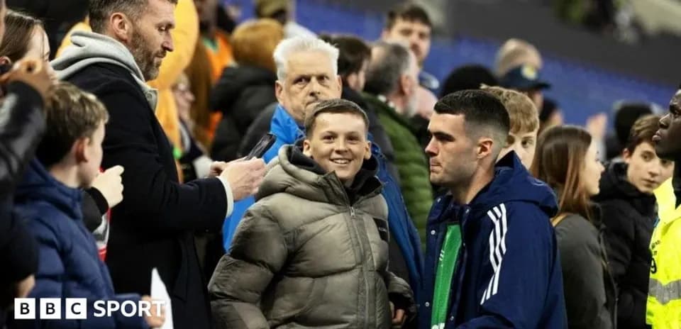 Fans interacting in stadium crowd after match
