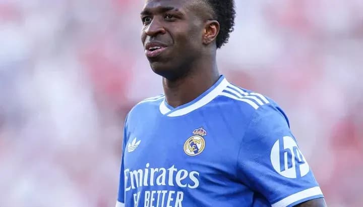 Vinícius Júnior in Real Madrid blue jersey on field Vinícius Júnior in Real Madrid blue jersey on field
