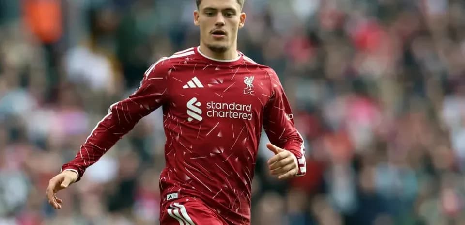 Liverpool player running on the pitch during match