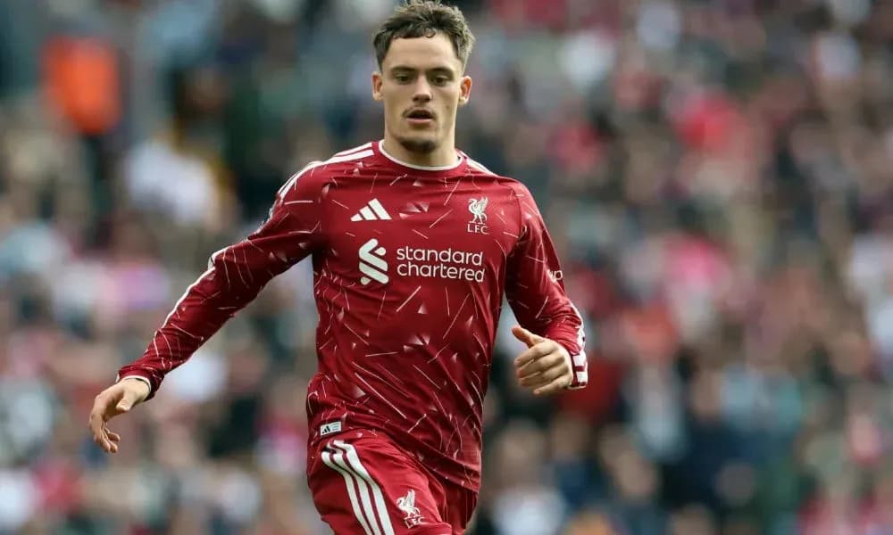 Liverpool player running on the pitch during match