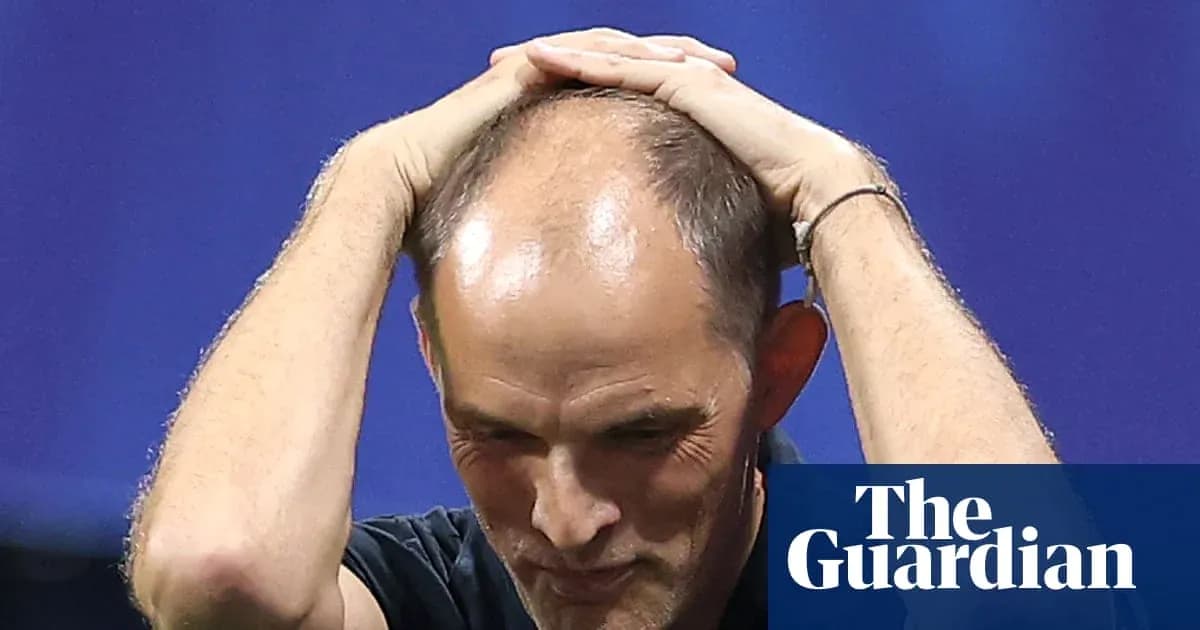 Coach holding head during tense moment on field Coach holding head during tense moment on field