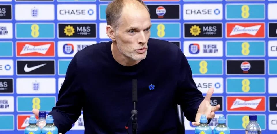 Manager speaking at press conference with drinks