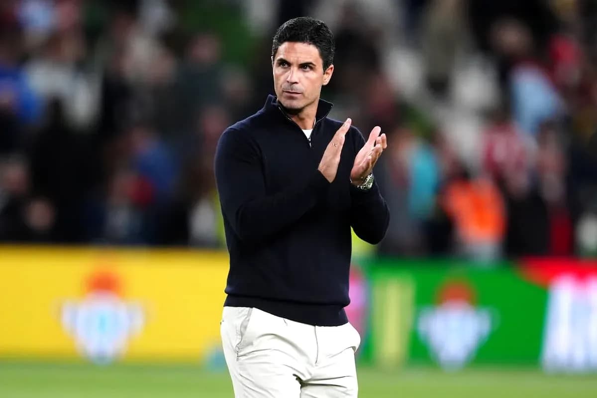 Coach applauding during a match at the stadium