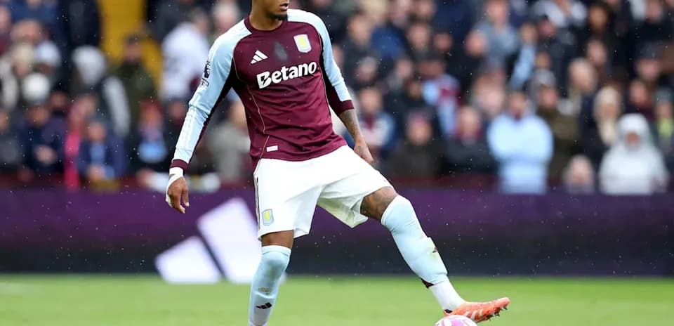 Player in Aston Villa kit preparing to kick the ball