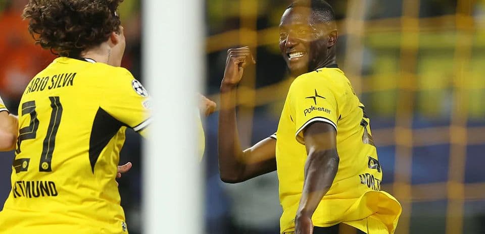 Players celebrating a goal during a match