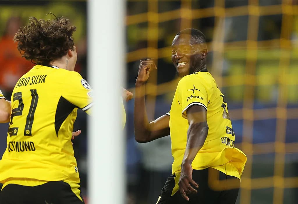 Players celebrating a goal during a match