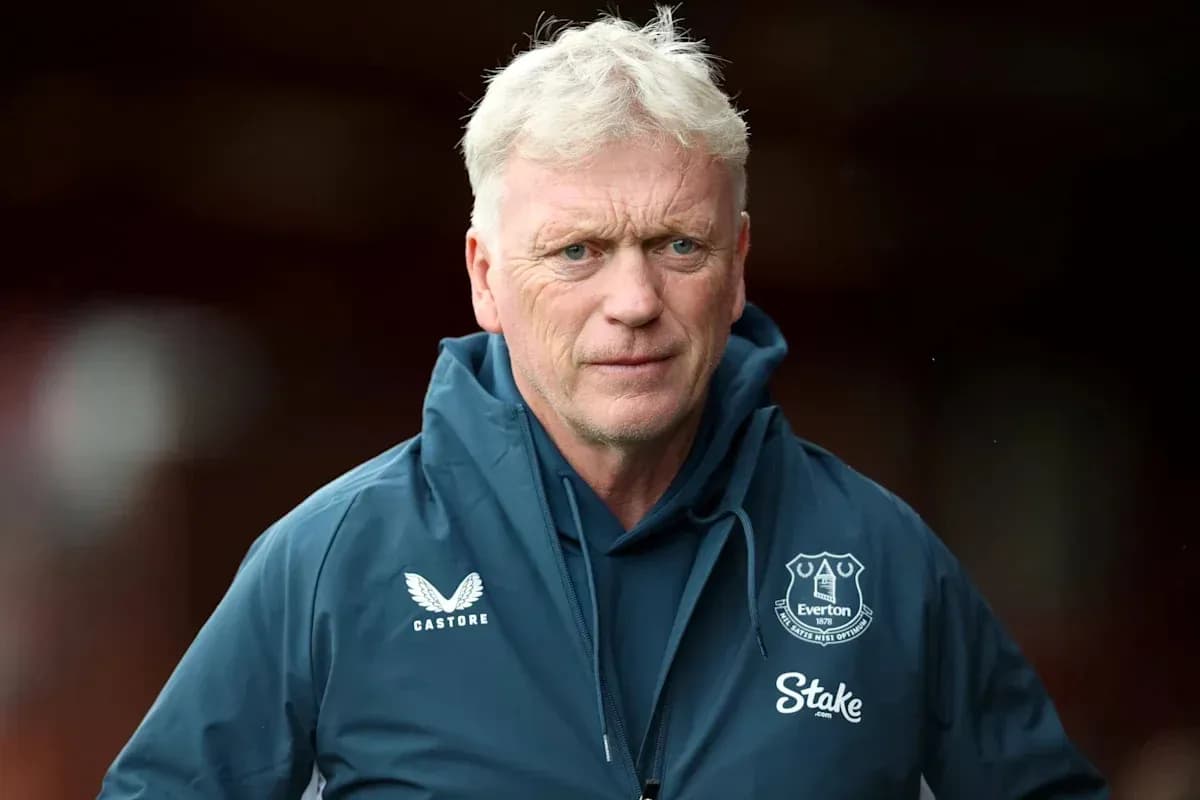 Manager wearing Everton jacket on the pitch
