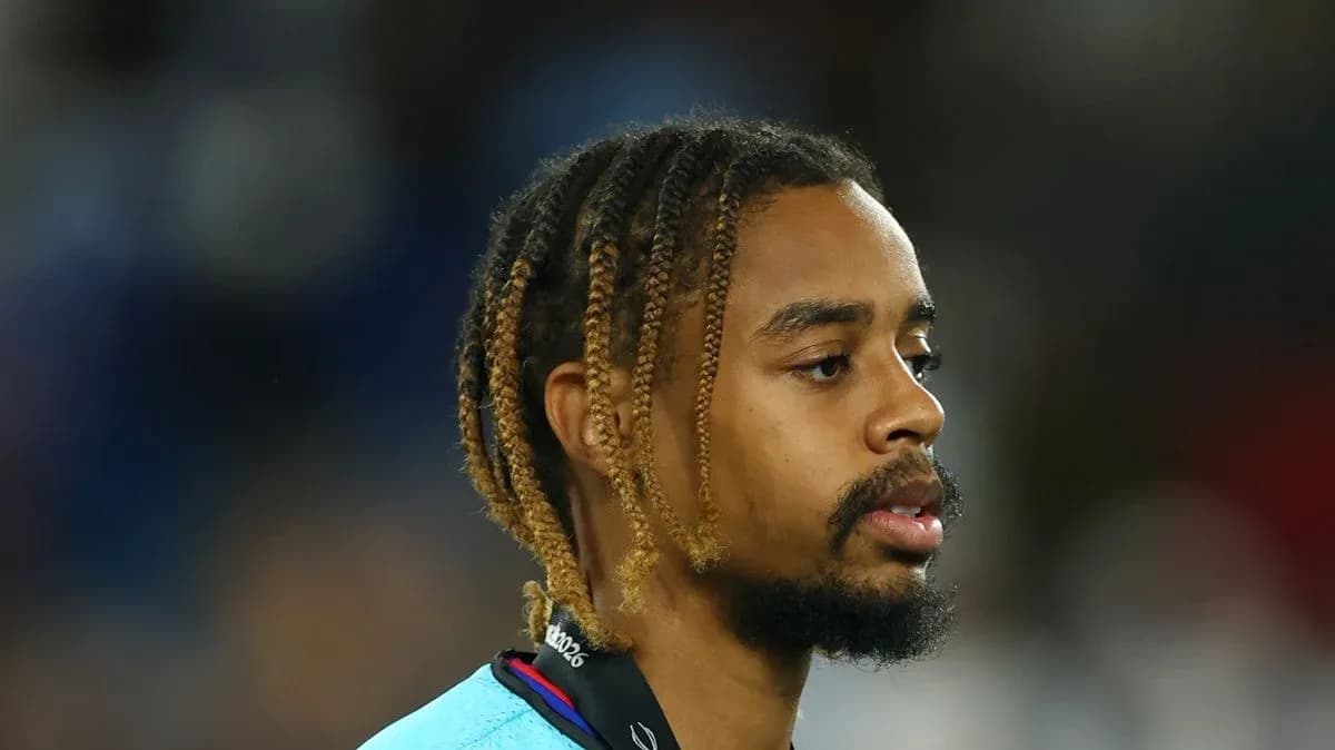 Player with braided hair on the field Player with braided hair on the field