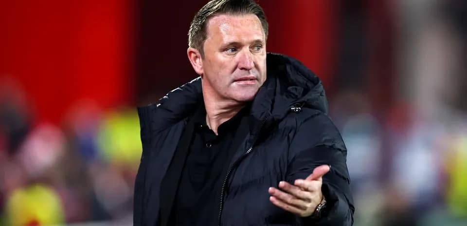 Manager gesturing during a football match