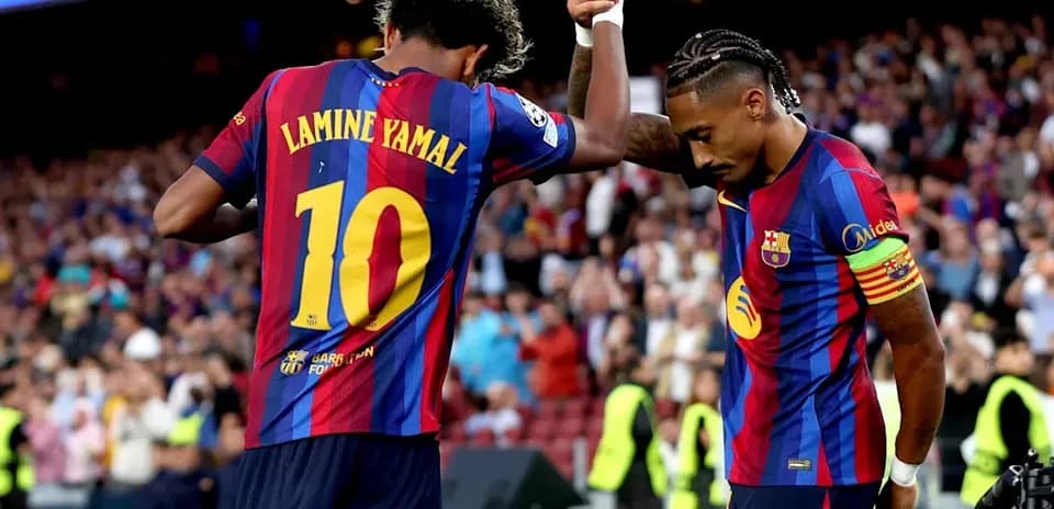 Lamine Yamal celebrating with teammate during match