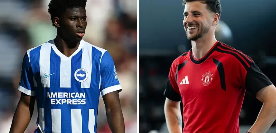 Two football players in club jerseys posing for photo