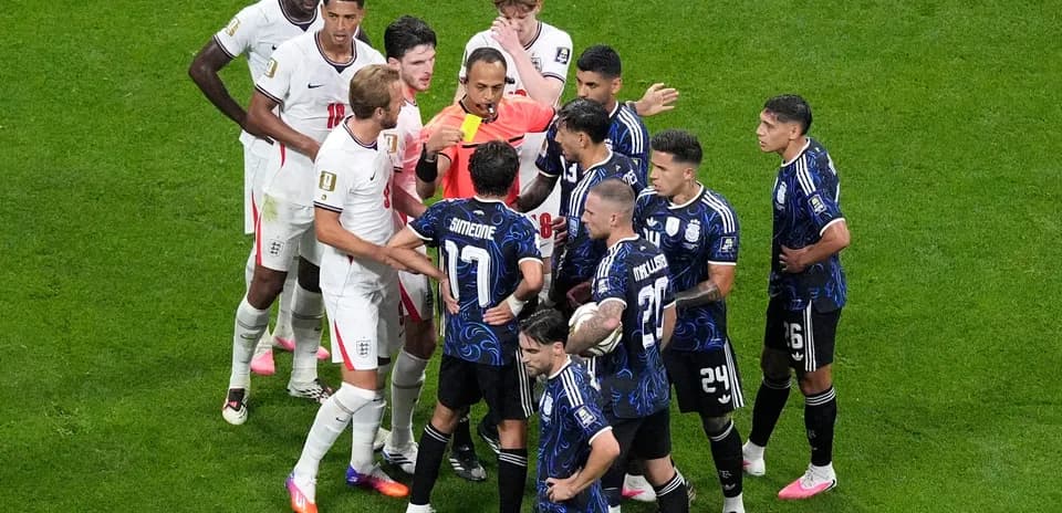 Players arguing with referee during match