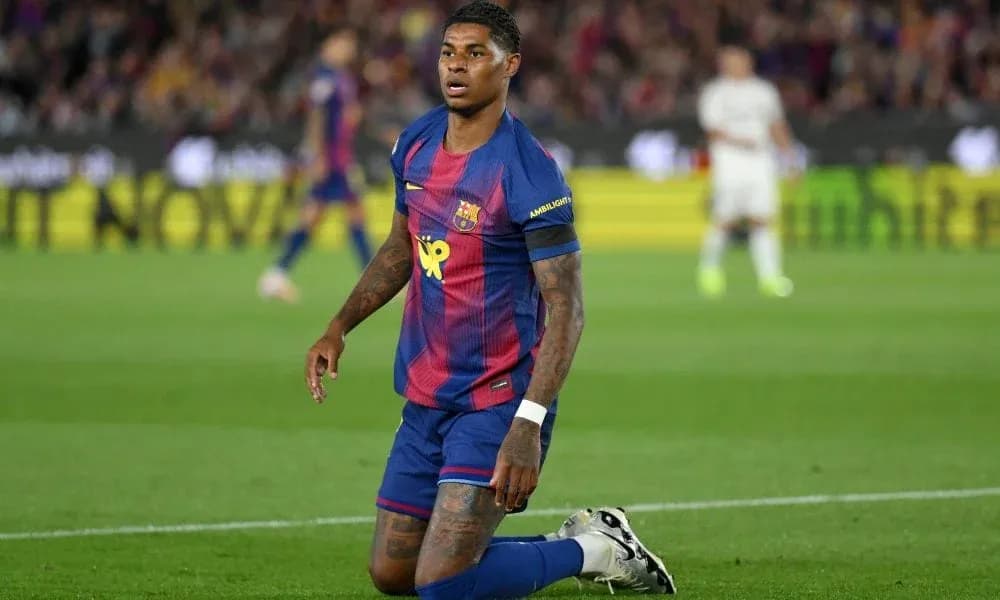 Barcelona player kneeling on the pitch during match