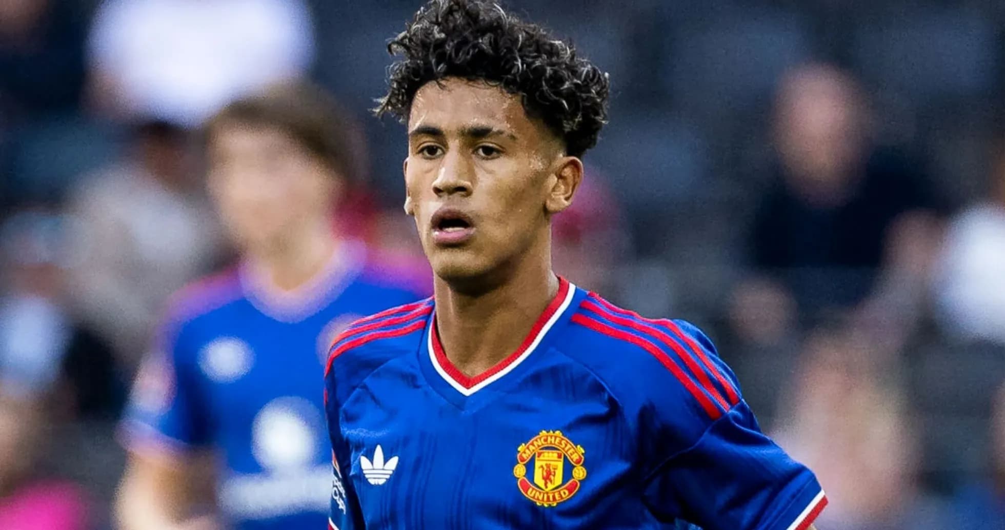 Young player in Manchester United kit on field