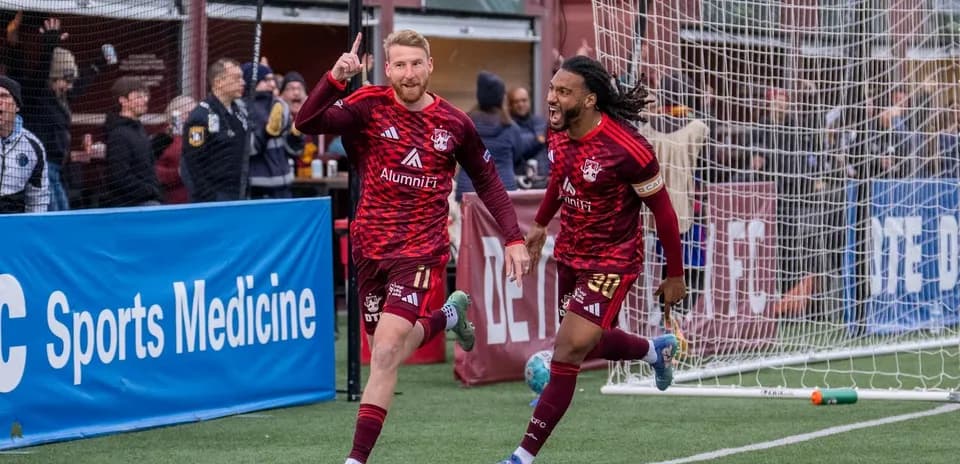 Players celebrating a goal during match