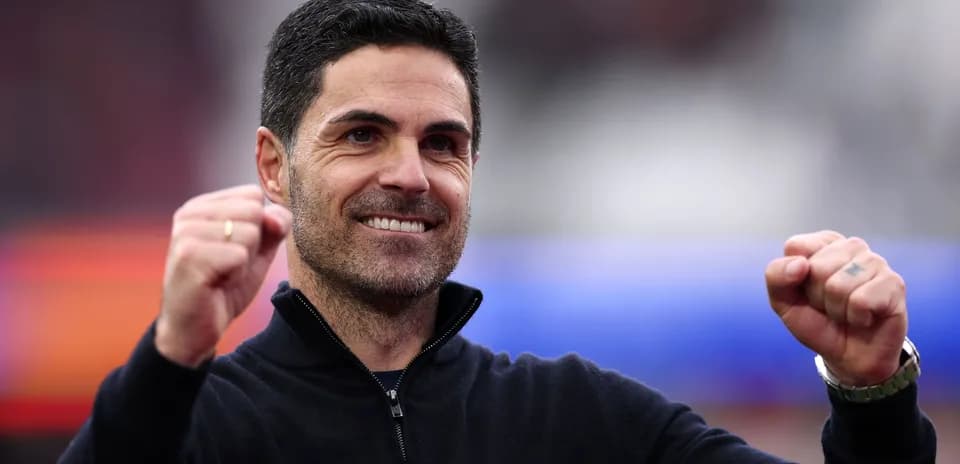 Manager celebrating with clenched fists and smile