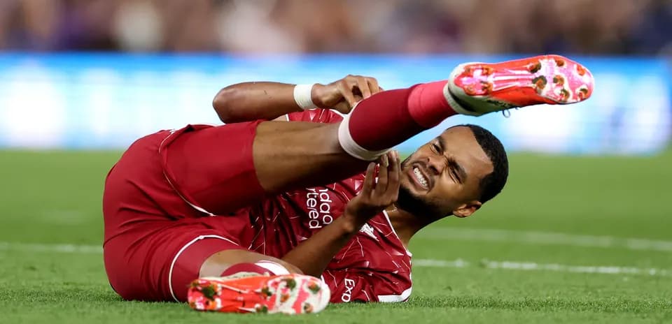 Player lying on the ground with injured leg