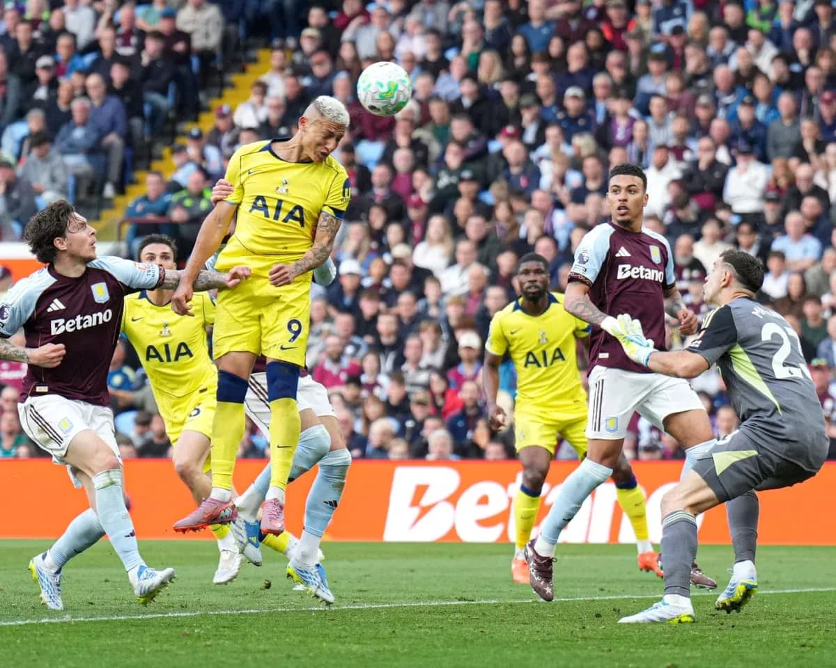 Richarlison heading the ball in Premier League match