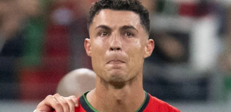 Football player wearing Portugal jersey during match