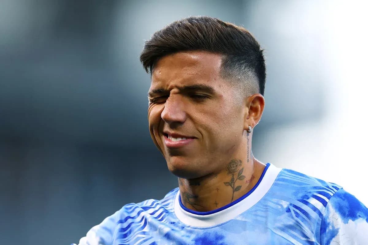 Player with tattoos smiling during warm-up session