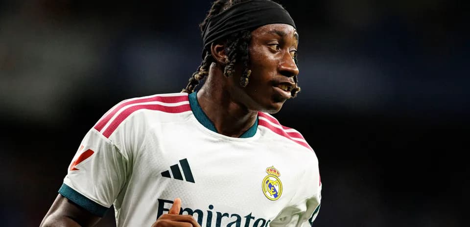 Player in Real Madrid kit running on the field