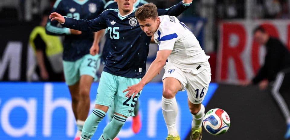 Two players competing for the ball during match