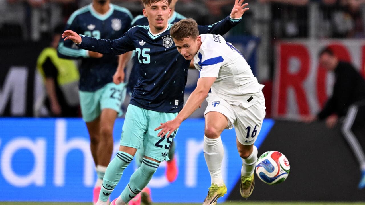 Two players competing for the ball during match