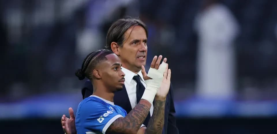 Player and coach acknowledging fans after match
