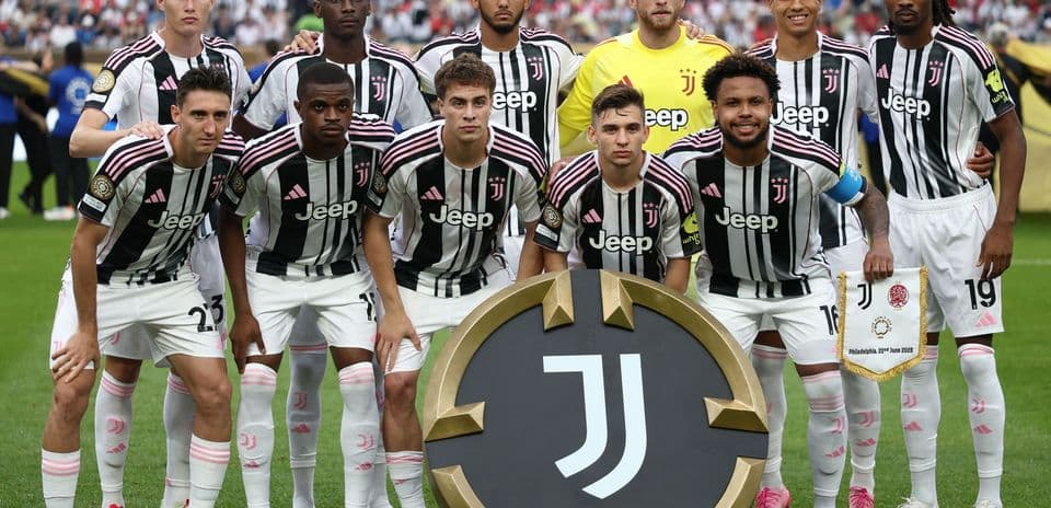 Juventus players posing with club emblem before match