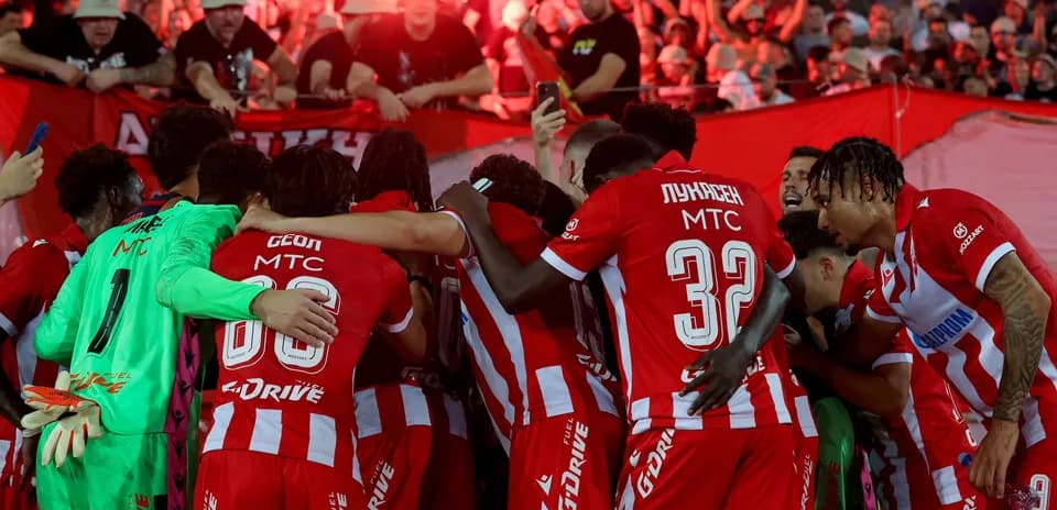 FK Crvena Zvezda players celebrating with fans