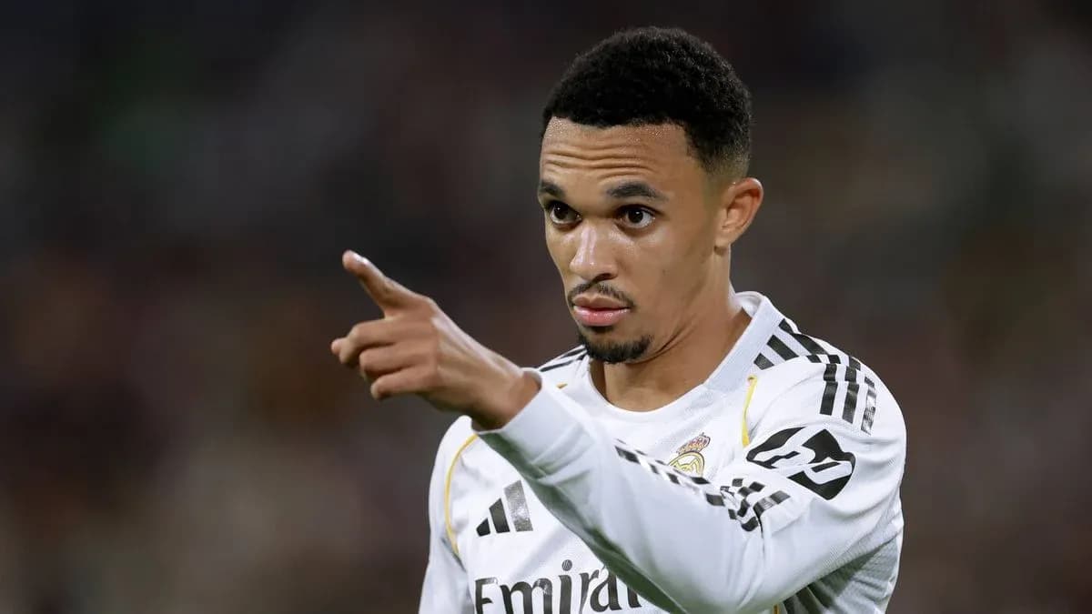 Player gesturing during a match wearing Real Madrid kit