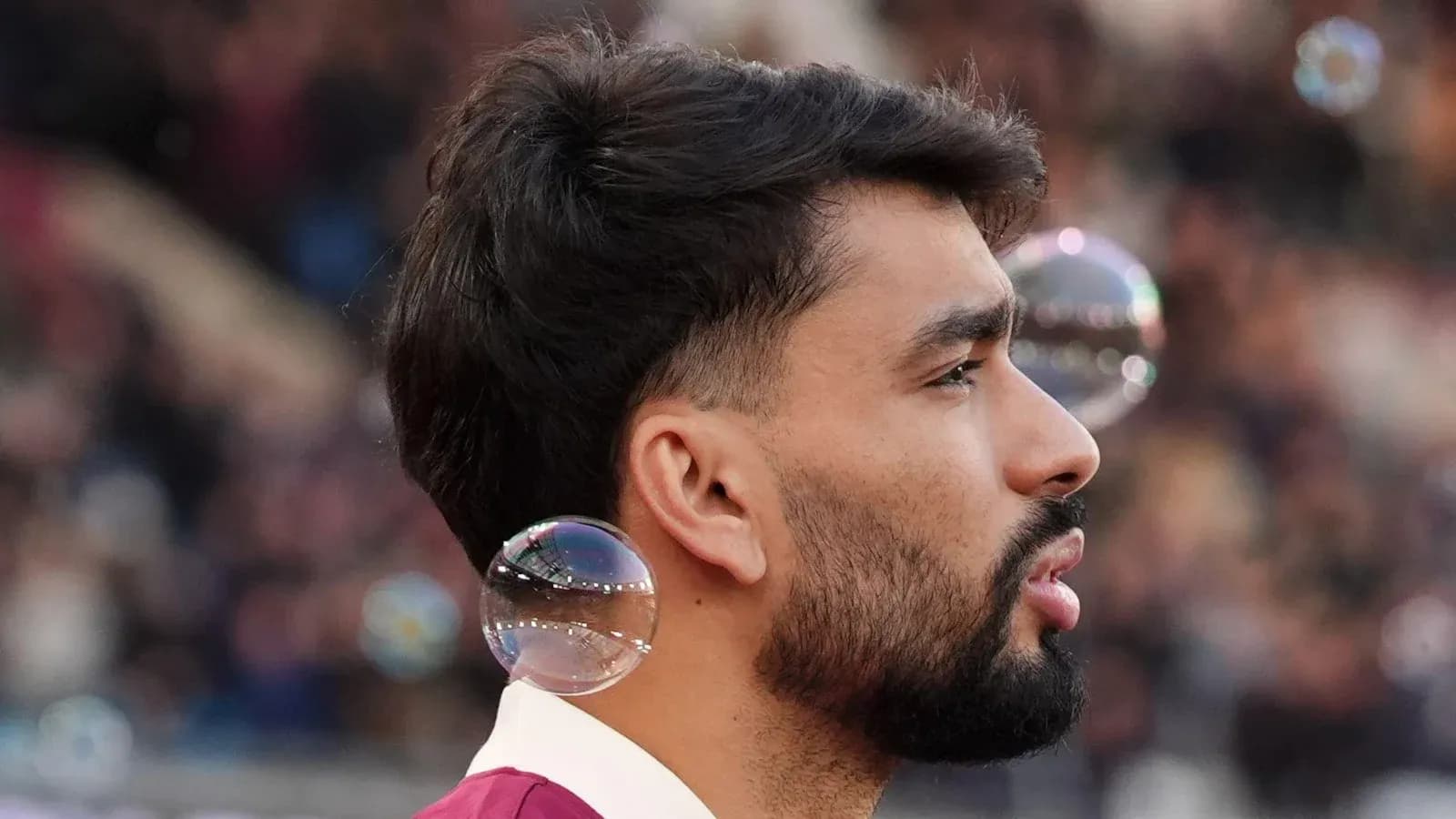 Player with bubbles near ear during match