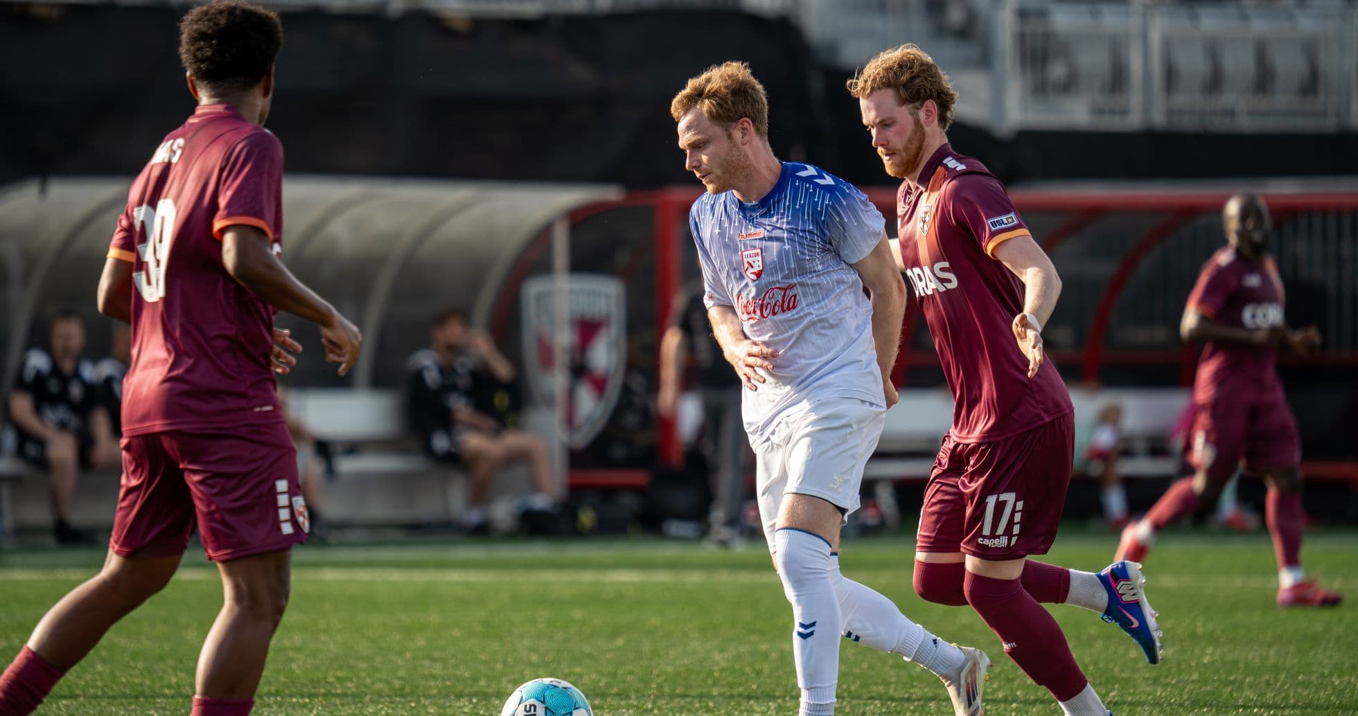 Players competing for the ball in USL match