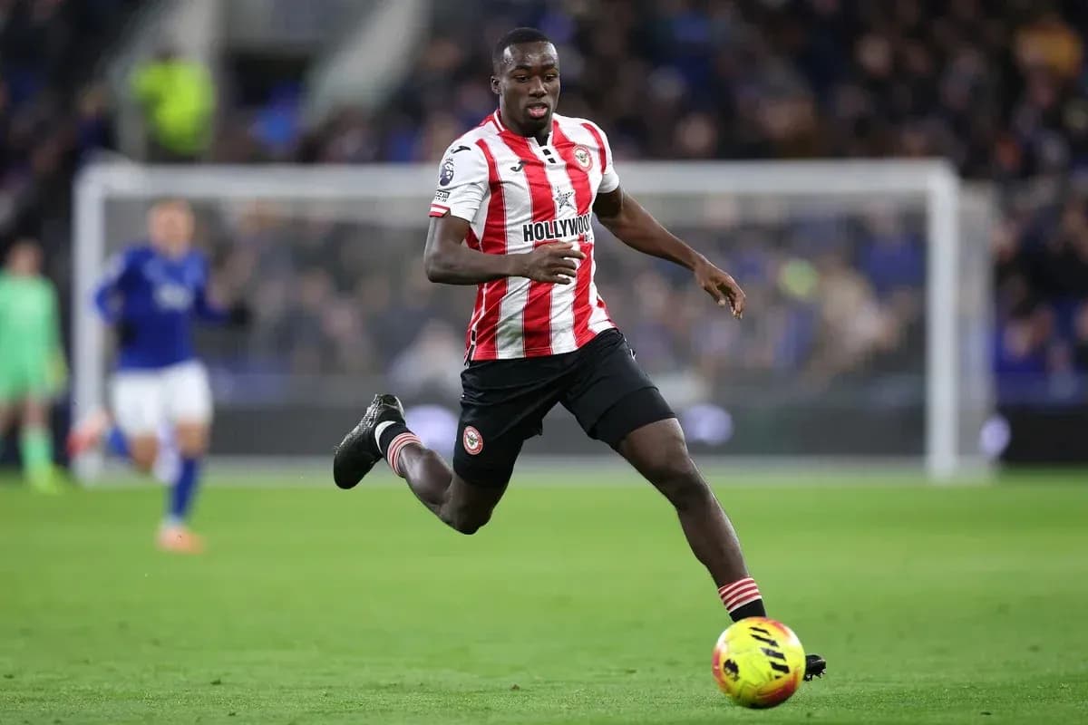 Brentford player sprinting on the pitch during match