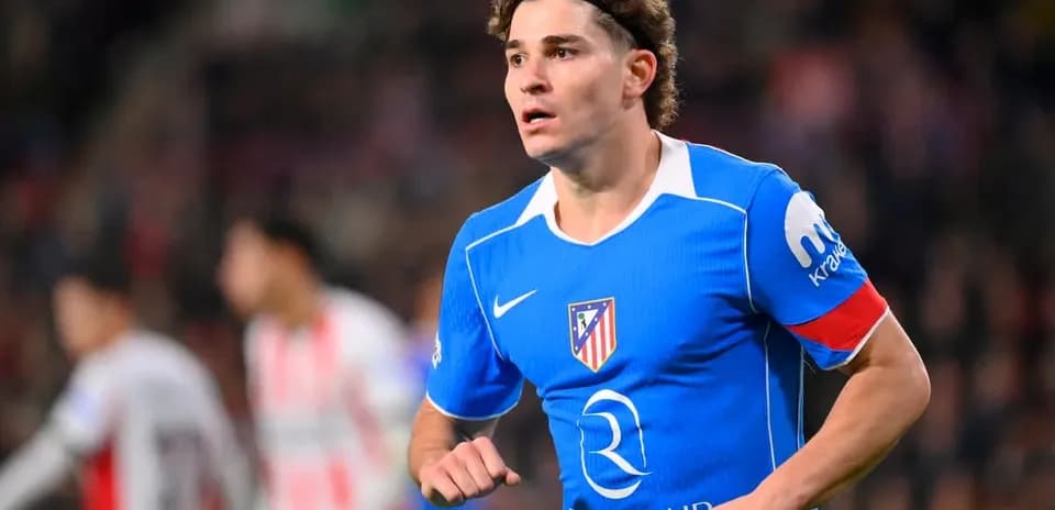 Player wearing blue Atletico Madrid jersey during match