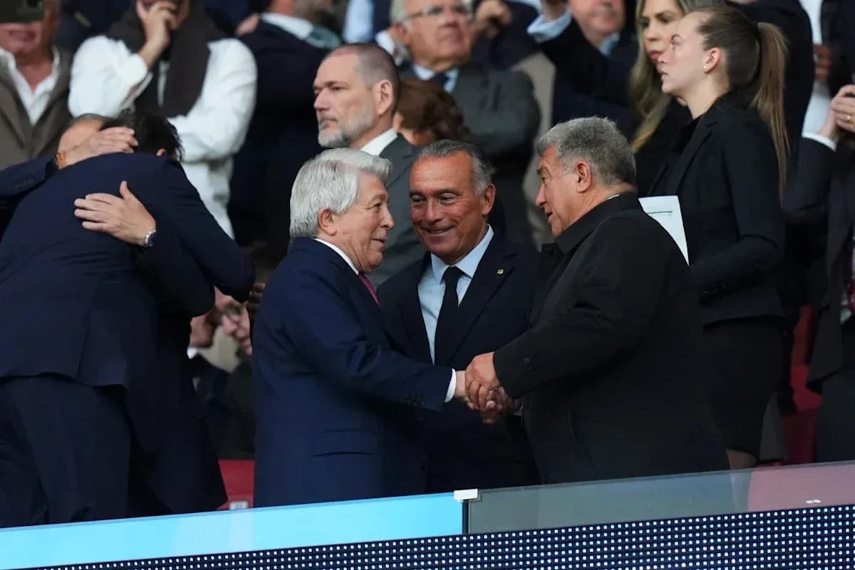Three men shaking hands in a stadium box