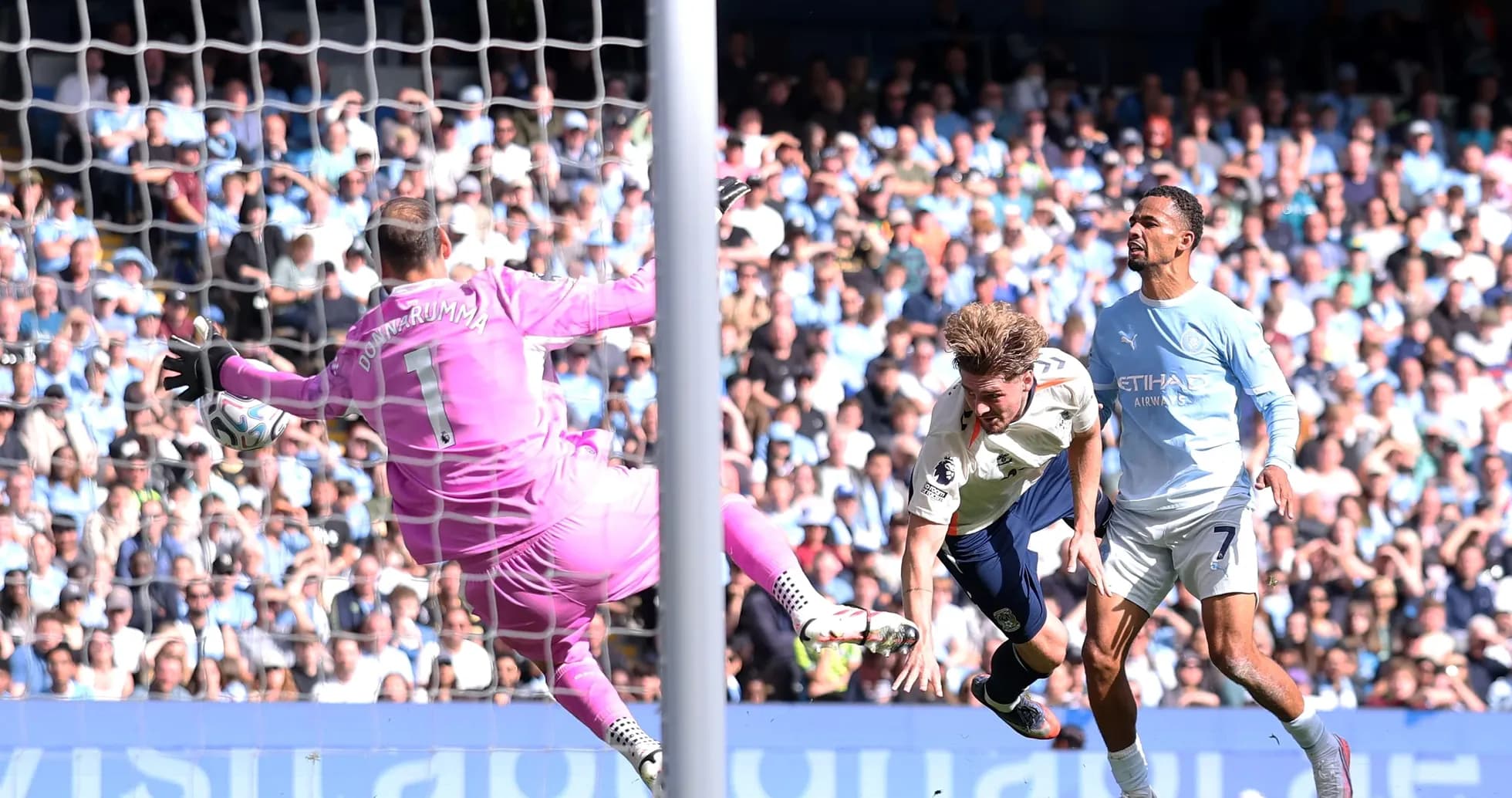 Goalkeeper saving a shot during intense match action
