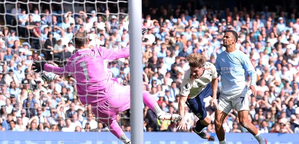 Goalkeeper saving a shot during intense match action